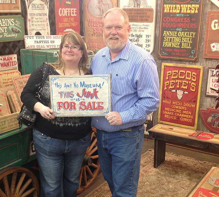 Jan and Garrett buying signs that we see in the Gift Shop, we will not sell this one it has a special meaning to us